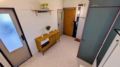 a hallway with a room with a mirror and a door at Stylish Prague 6 Apartment with balcony in Prague