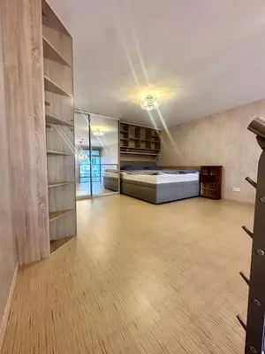 a large room with a bed and a closet at Loft Ballerina in Prague