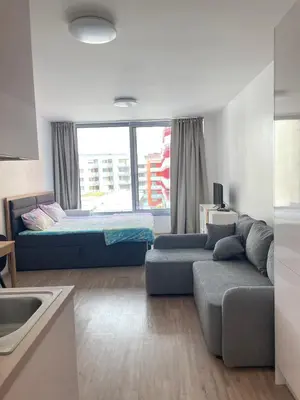 a living room with a couch and a bed at Harmony106 in Prague