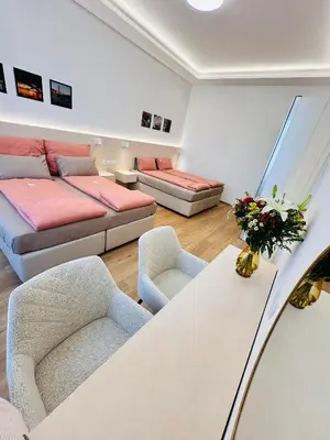 a living room with a couch and a table at Old Town Prague Apartment in Prague