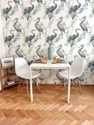 a dining room with a dinosaur wallpaper at Studio Oliver in Prague