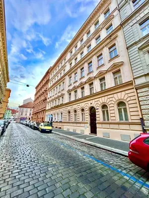 a cobblestone street in front of a large building at Studio Oliver in Prague