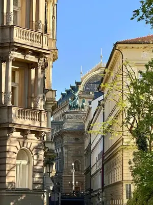 a building next to another building in a city at Apartment Divadelni - Historic Center & steps from Charles Bridge in Prague