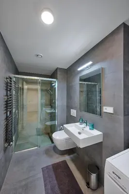a bathroom with a toilet and a sink and a shower at Residence Kobrova with free parking in Prague