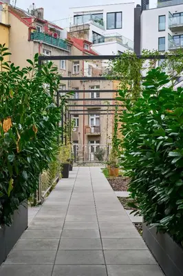 a walkway in a city with buildings at Residence Kobrova with free parking in Prague