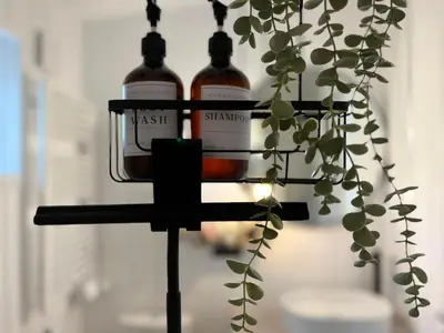 a candle holder with two bottles of wine at Garden Residence - The Lotus in Drahobudice