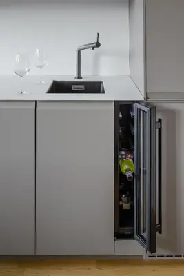 a kitchen with a sink and wine glasses at Urban Balance Suite, Andel in Prague