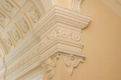 an ornate column on the side of a building at HOMELY l 5 min to Airport Express,Train Station with self check in in Prague