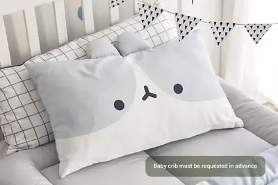 a pillow with the face of a snowman on it at HOMELY l 5 min to Airport Express,Train Station with self check in in Prague