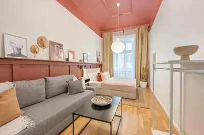 a living room with a couch and a table at HOMELY I 50m2 central APT I ELEVATORI Park & Museum View in Prague