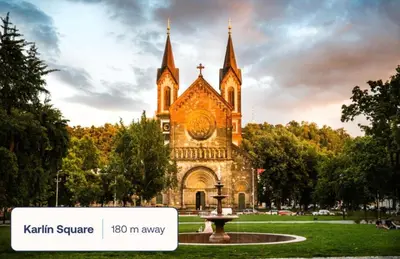 a church with a fountain in front of it at Modern studio with terrace in Prague