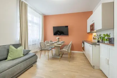 a living room with a couch and a table at HOMELY I Central 44m2 APT I ELEVATOR I Self Check-In in Prague