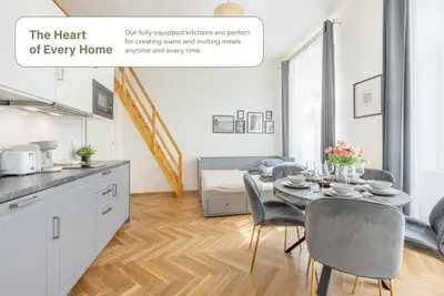 a kitchen and dining room with a table and chairs at HOMELY I Central 44m2 APT I ELEVATOR I Self Check-In in Prague