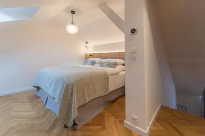 a bathroom with a shower with a glass door at Six Residences Prague in Prague
