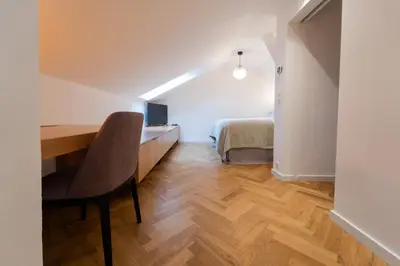 an orange light hanging from a wall at Six Residences Prague in Prague