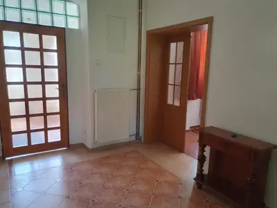 an empty room with two doors and a table at Statek U Šimla in Lážovice