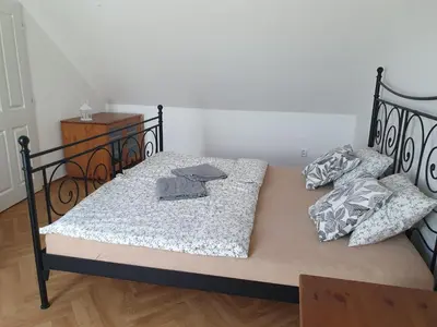 a bed with two pillows on it in a room at Statek U Šimla in Lážovice