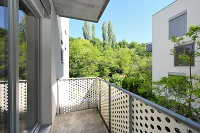 a balcony with a view of the trees at New Apartment in Heart of Prague in Prague