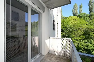 a balcony with a view of a window at New Apartment in Heart of Prague in Prague