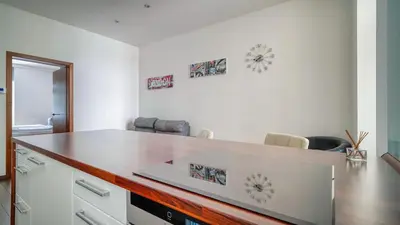 a kitchen with a counter top in a room at Botanical Escape Apartment in Prague