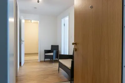 a room with two chairs and a door at New Apartment, close Prague center, Free Parking in Prague