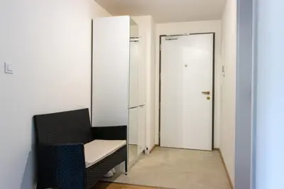 a room with a chair and a door at New Apartment, close Prague center, Free Parking in Prague