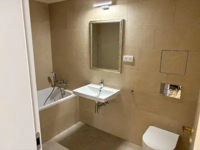 a bathroom with a sink and a toilet and a mirror at New Apartment, close Prague center, Free Parking in Prague