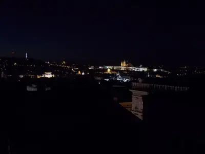 a view of a city at night with lights at Top Wenceslas Square Apartment in Prague