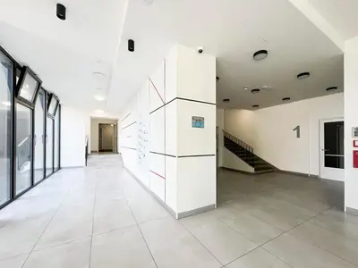 an empty room with white walls and a staircase at Vila Grebovka in Prague