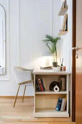 a white desk with a chair and a book shelf at Rentero Spacious Smíchov 2 Bedroom Apartment with Excellent Tram Connection in Prague