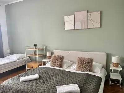 a bedroom with a bed with two pillows on it at 2BR Gateway on the Rybna in Prague