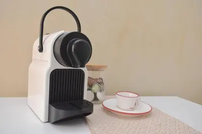 a coffee maker and a cup on a table at Central one bedroom apartment in Prague