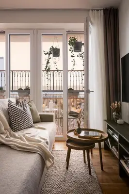 a living room with a couch and a table at Modern studio with terrace in Prague