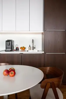 a white table and chairs in a kitchen at Modern studio with terrace in Prague