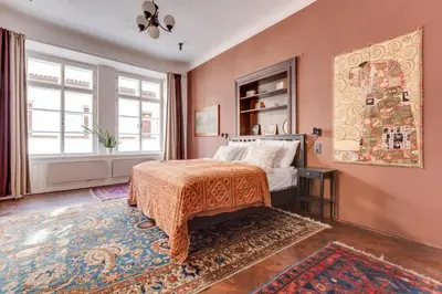 a bedroom with a bed and a rug at Old Town Magical Stay Comfy 2BDR Historic House in Prague