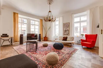 a living room with a couch and a rug at Old Town Magical Stay Comfy 2BDR Historic House in Prague