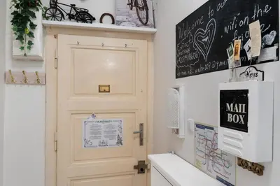 a bathroom with a door and a chalkboard on the wall at Cozy 2 Bedroom Flat in Prague in Prague