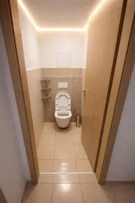 a small bathroom with a toilet in a room at Family, party Apartament in Prague