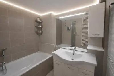 a bathroom with a sink and a bath tub and a sink at Family, party Apartament in Prague
