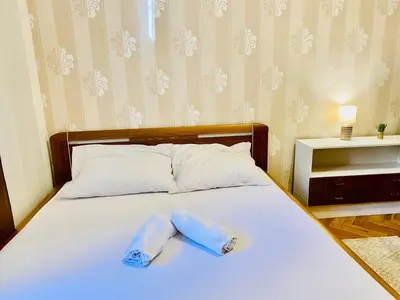 two towels on a bed in a room at Prague service Apartment - Central square location in Prague