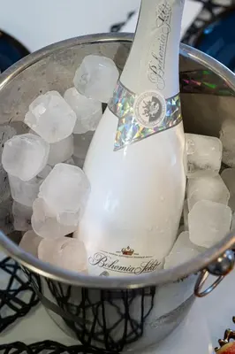 a bottle of milk in a pot filled with ice at White Rabbit's Residence in Prague