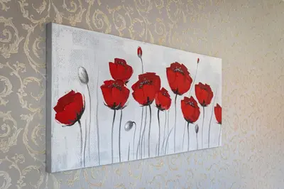 a painting of red flowers on a wall at White Rabbit's Residence in Prague