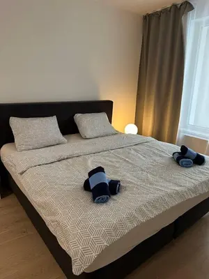 a bed with two stuffed animals on top of it at Royal Stay Wenceslas Square in Prague