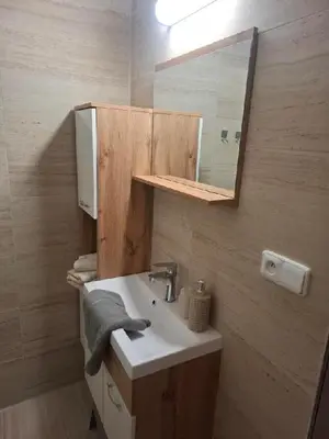 a bathroom with a sink and a mirror at Apartmán Libochovice in Libochovice