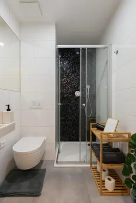 a bathroom with a shower and a toilet at Central City Apartments in Prague