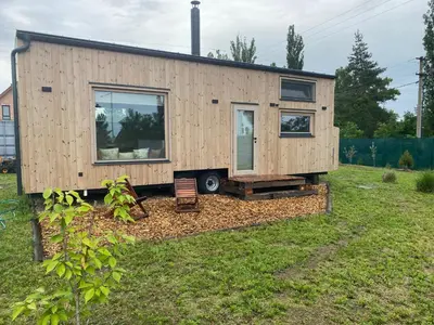 a tiny house sitting on top of a yard at Tiny House in Stará Boleslav