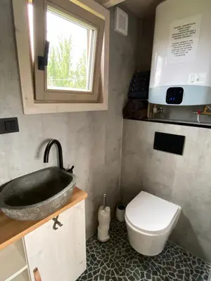 a bathroom with a sink and a toilet at Tiny House in Stará Boleslav