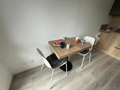 a wooden table and chairs in a room at Apartmán Slapy - Ždáň in Slapy