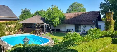 a house with a swimming pool in a yard at Oáza klidu v Březové in Březová