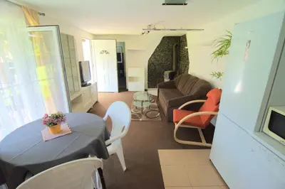 a living room with a table and a couch at Oáza klidu v Březové in Březová